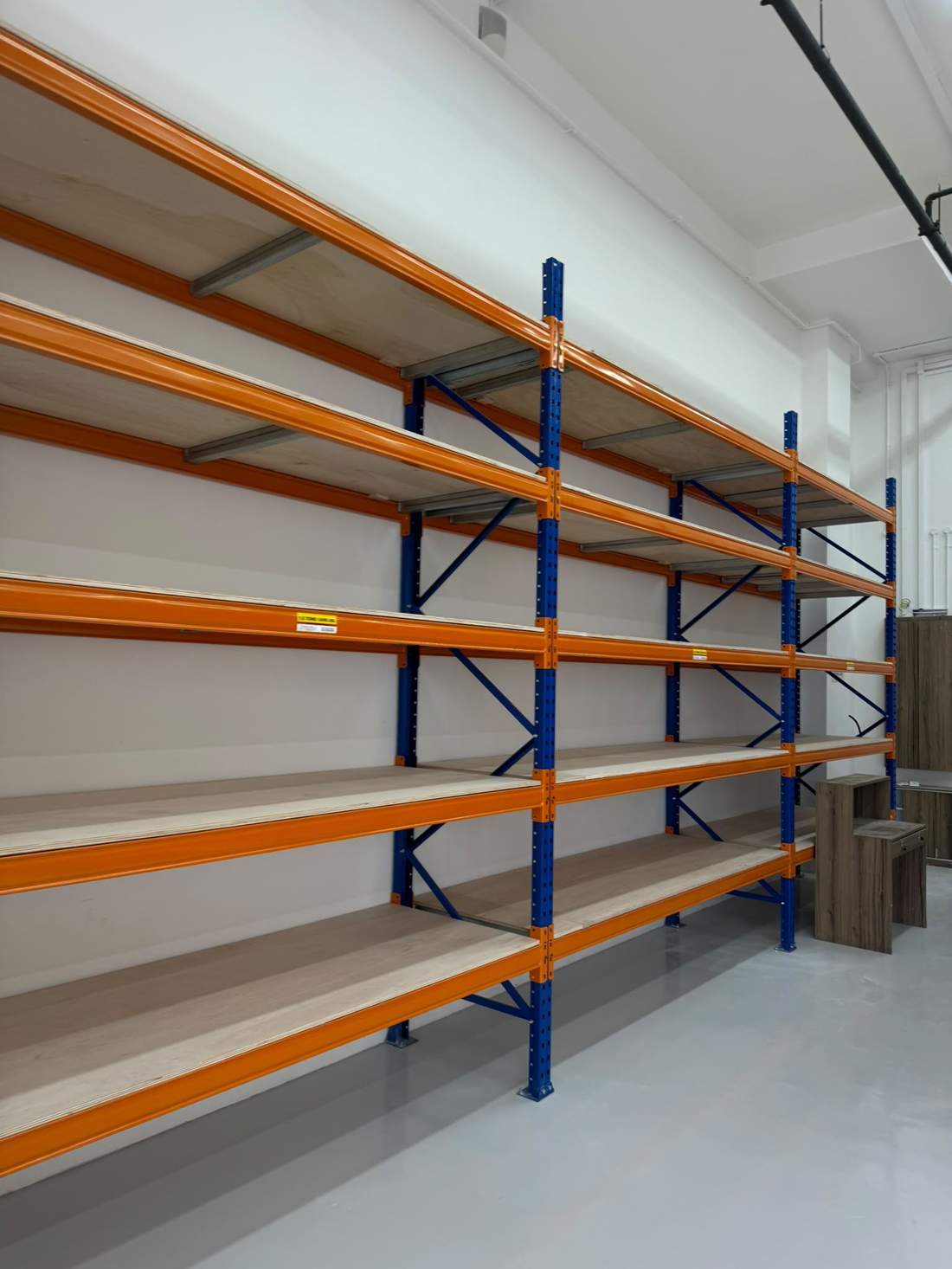 Long span racking bays with plywood decking