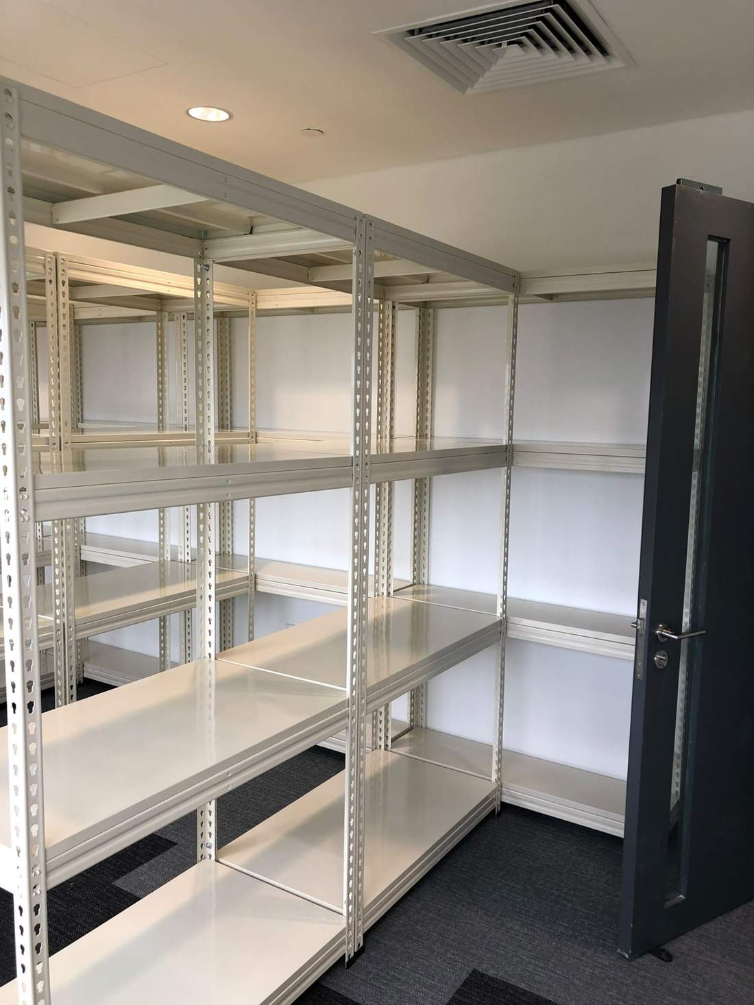 White boltless shelving in archive room