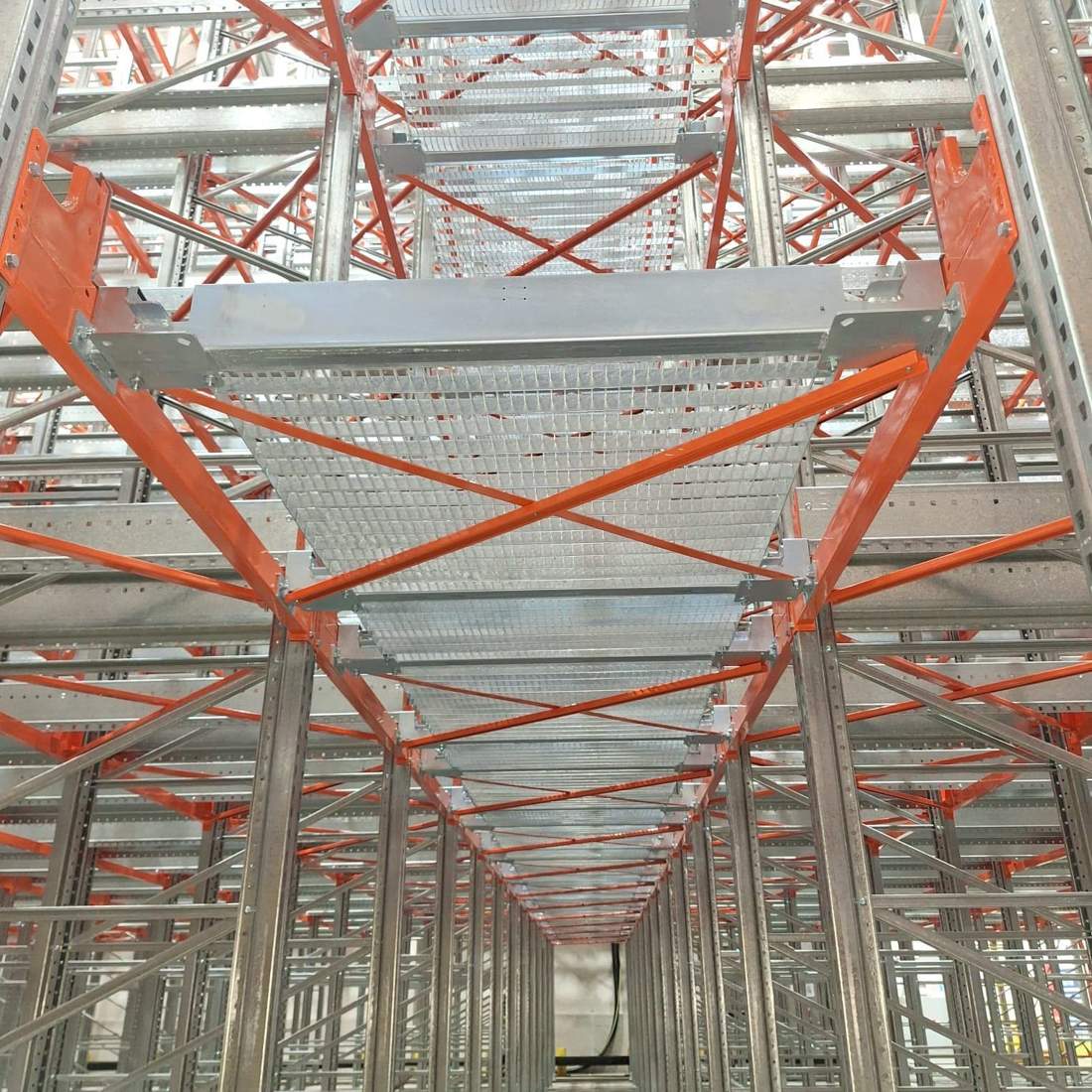 Shuttle racking rail and mesh decking detail